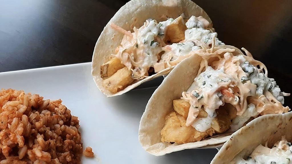 Fish Fry Tacos · Fried Cod topped with Red Cabbage Slaw and Mexican Crema
