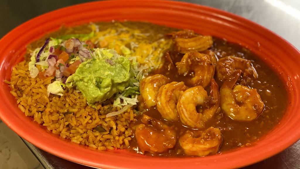Camarones A La Diabla · Grilled shrimp cooked with our delicious diabla sauce served with rice, beans and three tortillas flour or corn