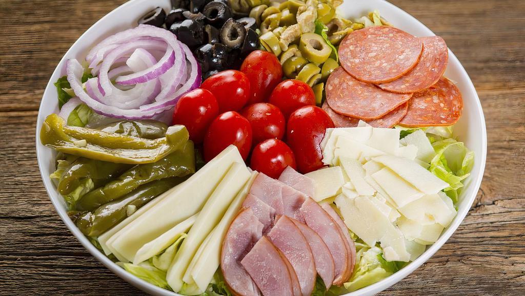 Antipasto Salad · Romaine & iceberg lettuce, spinach leaves, green pepper, red onion, black & green olives, pepperoni, Canadian bacon, grape tomato, mozzarella cheese & shaved asiago served with our signature sweet Italian dressing.
