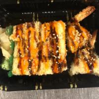 Crunch Roll · Shrimp tempura, cucumber, kaiware inside topped with crunch, masago, and nori fumi.