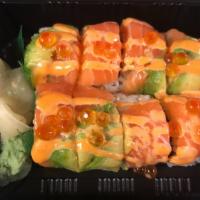 Salmon Family Roll · Spicy tuna, crunch inside, topped with salmon, avocado and ikura.