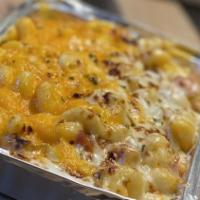 Loaded Baked Potato Mac · Cheddar and Gruyere cheeses, fried chucks of potato, and bacon topped with seasoned bread cr...