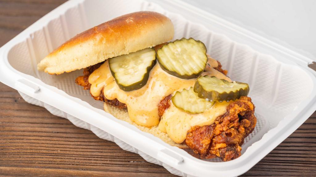 Spicy Chikin Sandwich · Crispy fried chicken dipped in Sichuan Nom Nom topped with Spicy Mayo and Pickle on a Brioche Bun.