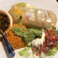 Chimichanga El Patron · Slow cooked pork in green sauce with a touch of beans stuffed inside a flour tortilla then d...
