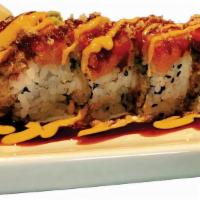 Red Dragon · Shrimp tempura and cucumber roll topped with spicy tuna, spicy mayo and eel sauce.