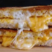 Triple Grilled Cheese & Soup · American, cheddar & Swiss melted on Italian panini.