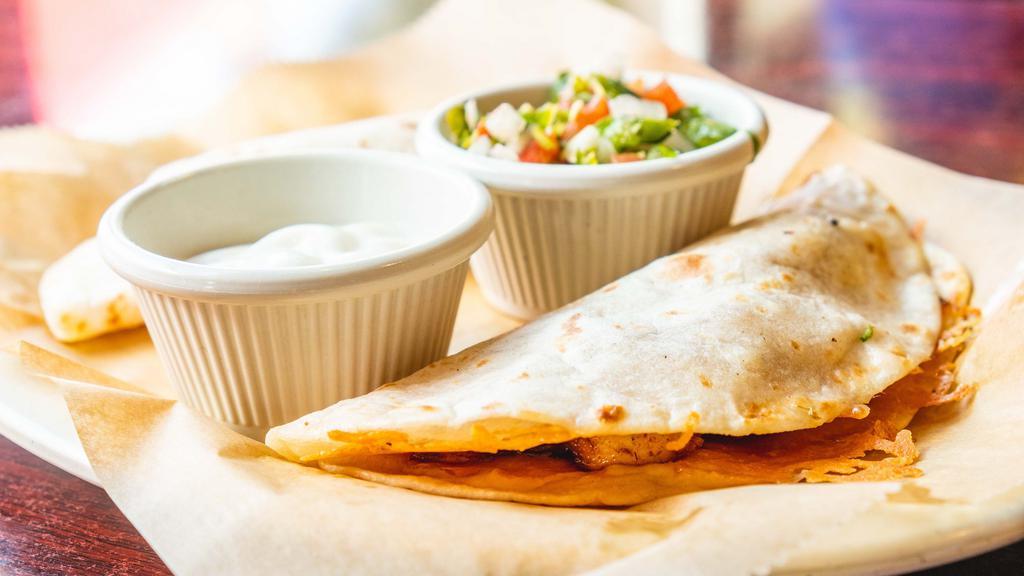 2 Quesadillas · Grilled flour tortilla filled with cheese and served with pico de gallo and sour cream. Add meat for an additional charge.