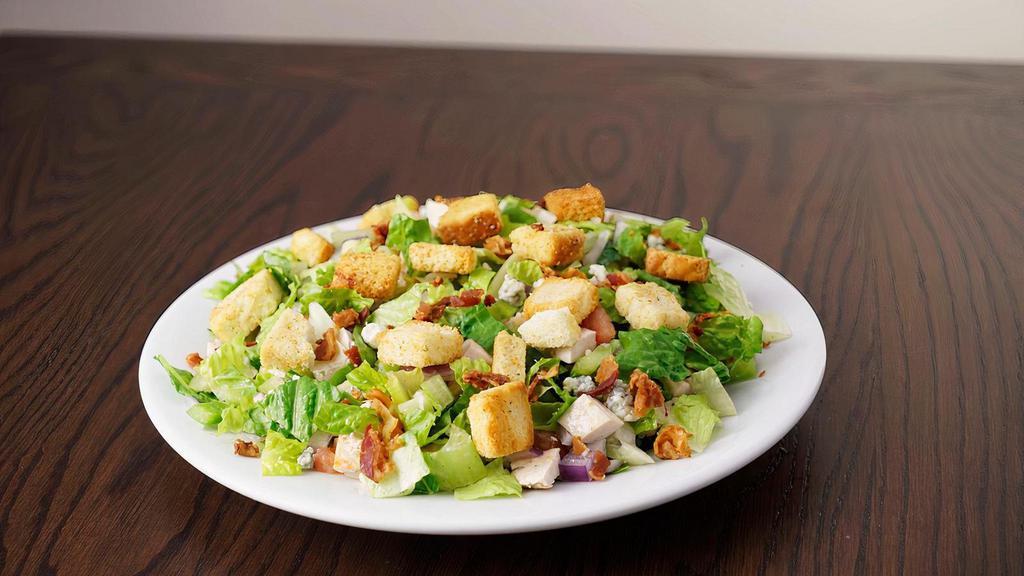 Chopped Salad · Romaine lettuce, pasta, chicken, bacon, gorgonzola, red onion, green pepper, grape tomatoes, crutons