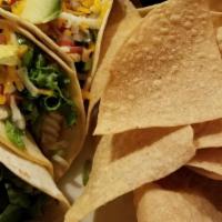 Walleye Tacos · Chunks of our famous grilled walleye in three warm flour tortillas, with lettuce, cheese, pi...