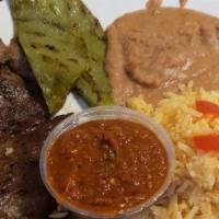 Bistec Asado Con Nopales · steak cook with cactus and beans