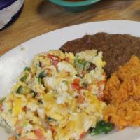 Huevos A La Mexicana  · mexican scrambled style egss served with beans and rice