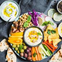 Mezze Platter · Hummus, Baba Ganough, Stuffed grape leaves, falafel, farmers salad & Pita Bread