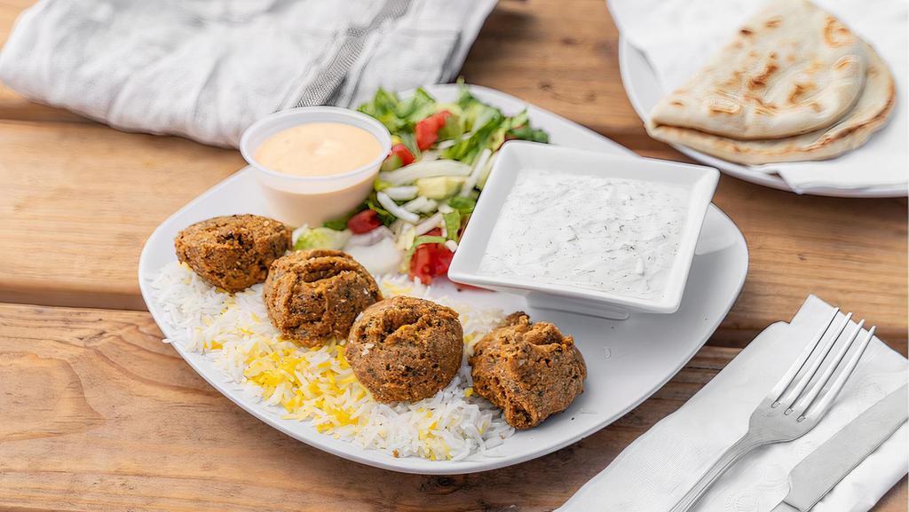 Falafel Combo Platter · Long grain rice, farmer's salad, pita bread, a choice of protein and a choice of dip Substitute rice with fries at no extra charge