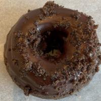 Bumpy Cake · Our Chocolate Cake Donut dipped in house made butter cream and topped with chocolate ganache...
