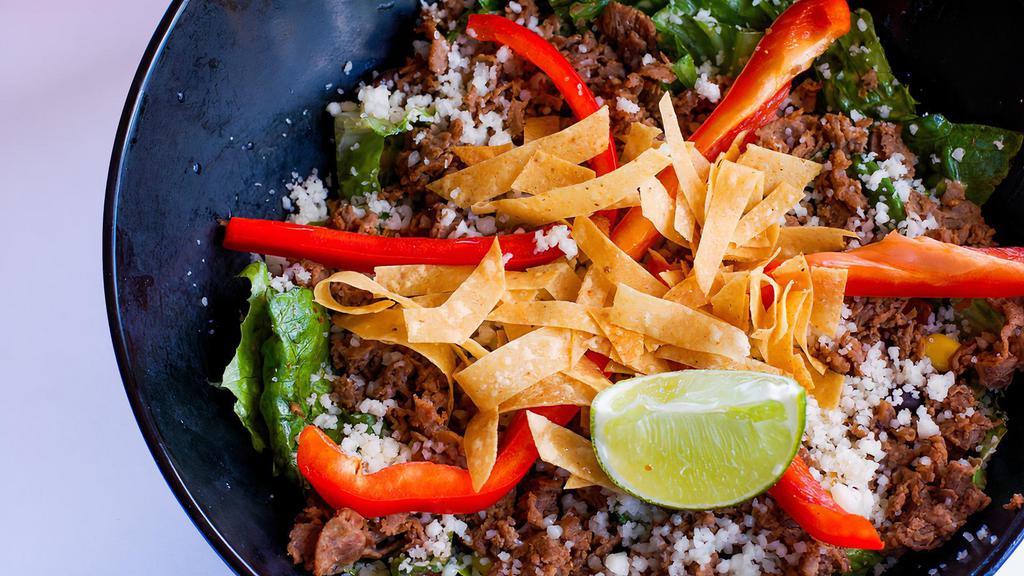 Steak & Greens Salad · Mix of romaine, green leaf and baby spinach. Beef cheesesteak, shredded mozzarella cheese, corn salsa, red bell peppers, tortilla strips and slice of lime. We suggest our Hickory Ranch dressing!