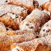 Regular Cannoli · Sweet, creamy Ricotta & chocolate chip filling, topped with nuts, in cannoli shell.