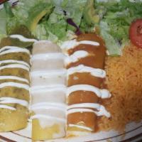 Enchiladas Bandera · One chicken enchilada with green sauce on top. One cheese enchilada cheese dip on top. One b...