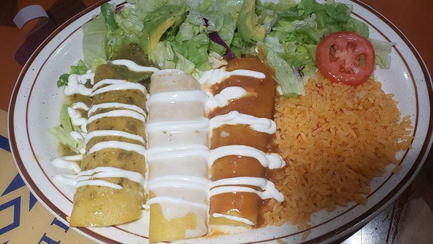 Enchiladas Bandera · One chicken enchilada with green sauce on top. One cheese enchilada cheese dip on top. One beef enchilada with red sauce on top. Sour cream on top. Served with rice, mixed salad, avocado, and tomato.