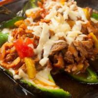 Chiapas · Chile poblano stuffed with sirloin steak, grilled mushrooms, bacon, tomatoes, zucchinis and ...