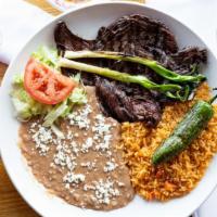 Carne Asada · Grilled sirloin steak served with Mexican rice, fried beans or black beans, fresh guacamole,...