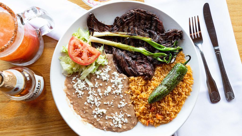 Carne Asada · Grilled sirloin steak served with Mexican rice, fried beans or black beans, fresh guacamole, mixed salad, Pico de Gallo and three flour tortillas.

Consuming raw or undercooked food can increase risk of foodborne illness.