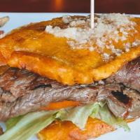 El Jibarito · Steak plantain sandwich. Includes mayonnaise, lettuce, tomato, onions, and garlic.