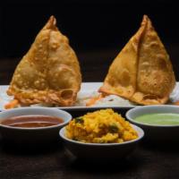 Vegetable Samosa (Vegetarian) · Deep fried triangular pastry filled with seasoned mashed potatoes and peas.