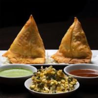 Kale Cheese Samosa · Deep fried triangular pastry filled with seasoned kale and cheese.