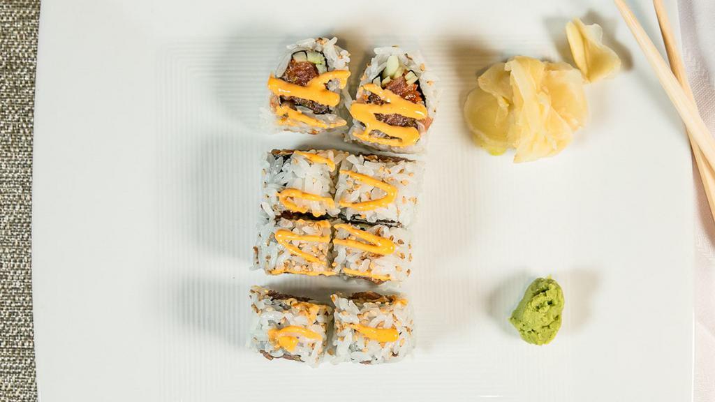 Spicy Tuna Roll · Tuna and avocado with spicy mayo rolled with rice and seaweed.