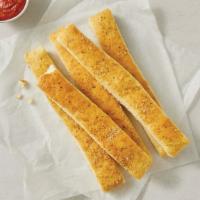 Cheese Sticks · Fresh, oven-baked dough smothered with cheese and sprinkled with Italian seasoning. Served w...