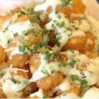 Garlic, Cheese & Chive Tots · Crafted with Garlic Aioli, Two Cheese Blend, Chives
