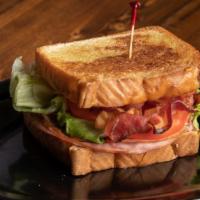 The Mug Club · A healthy portion of ham, turkey & bacon, cheddar cheese, lettuce, tomato & mayo, served on ...