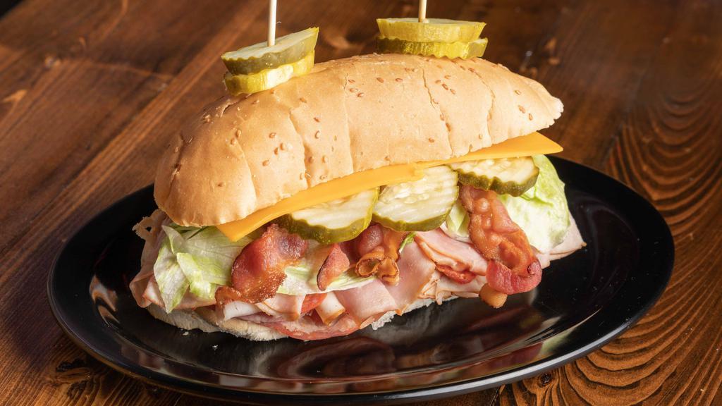 The Dagwood · The Mug's version of this legendary sandwich! Ham, salami, pepperoni, capicola, turkey & bacon. served with lettuce, tomato & pickle with a side of mayo.