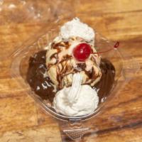 Hot Fudge Brownie Sundae · Our homemade brownie topped with vanilla ice cream, hot fudge, whipped cream, and chopped pe...