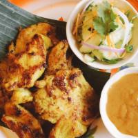 Satay Chicken · Grilled marinated chicken, coconut milk, curry, peanut sauce, and cucumber salad.
