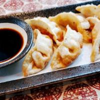 Chicken Potstickers · Fried chicken potstickers, soy vinaigrette dipping.