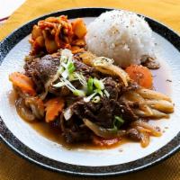 Korean Beef Bulgogi · Thin sliced beef, soy sauce, garlic, onion, carrot, sesame, and kimchi.