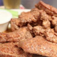 Chicken Wings · Large Chicken Wings tossed in your choice of sauce. JC Style, Cajun Rub, Hot, Mild, BBQ, Ter...