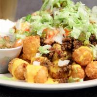 Beef Nachos Or Tachos · Homemade Tortilla Chips or Tater Tots smothered with Seasoned Ground Beef, Cheese, Jalapeños...