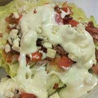 Wedge Salad · Lettuce, Tomatoes, Bacon, Bleu Cheese Crumbles & Dressing