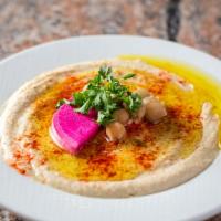 Hummus · Pita inn's famous recipe - a blend of ground chick peas and tahini, topped with olive oil.