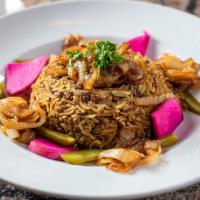 Mujadara · A traditional home recipe of rice and lentils topped with caramelized onions and served with...