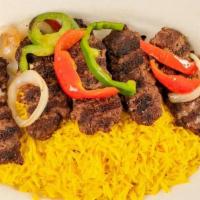 Kofta Kabob · Grilled seasoned lean ground beef, served with hummus, house salad, and basmati rice. Served...