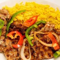 Chicken Kofta Kabob · Grilled seasoned lean ground chicken, served with hummus, house salad, and basmati rice. Ser...