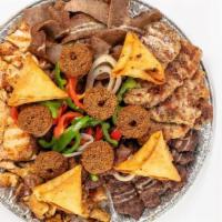 Family Platter For 2 · A mixed platter sliced roasted gyros, Chicken, Kofta, Lamb, Samosa, Falefel, Baba Ganouj,  S...