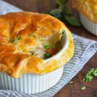Gourmet Chicken Pot Pie · Fresh, pulled white meat chicken, fresh broccoli, carrots, green peas, celery and cream sauc...