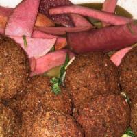Falafel · Vegetarian. (Four pieces). Vegetarian patty made from ground chickpeas, parsley, garlic, oni...