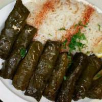 Stuffed Grape Leaves · Vegetarian. 4 Rolled grape leaves stuffed with rice, tomatoes, onions, parsley, olive oil an...
