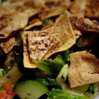 Half Tray Fatoush Salad · Fresh romaine lettuce, tomatoes, cucumbers, onions, parsley, seasoned pita chips. Blended wi...