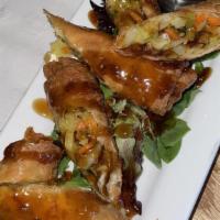 Vegetable Eggrolls · Deep-fried golden brown drizzled with teriyaki and sweet chile sauce finished with chopped g...